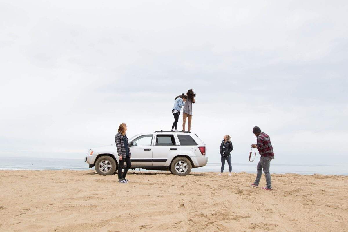 people-in-beach-with-car-new-smyrna-beach-parking