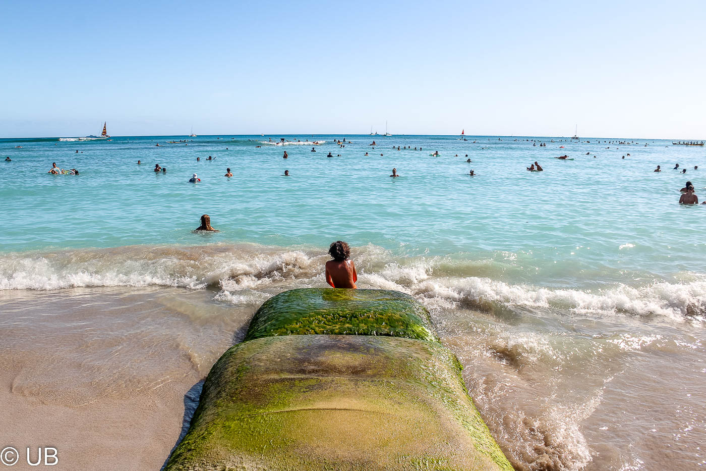 boy over looking the beach of waikiki