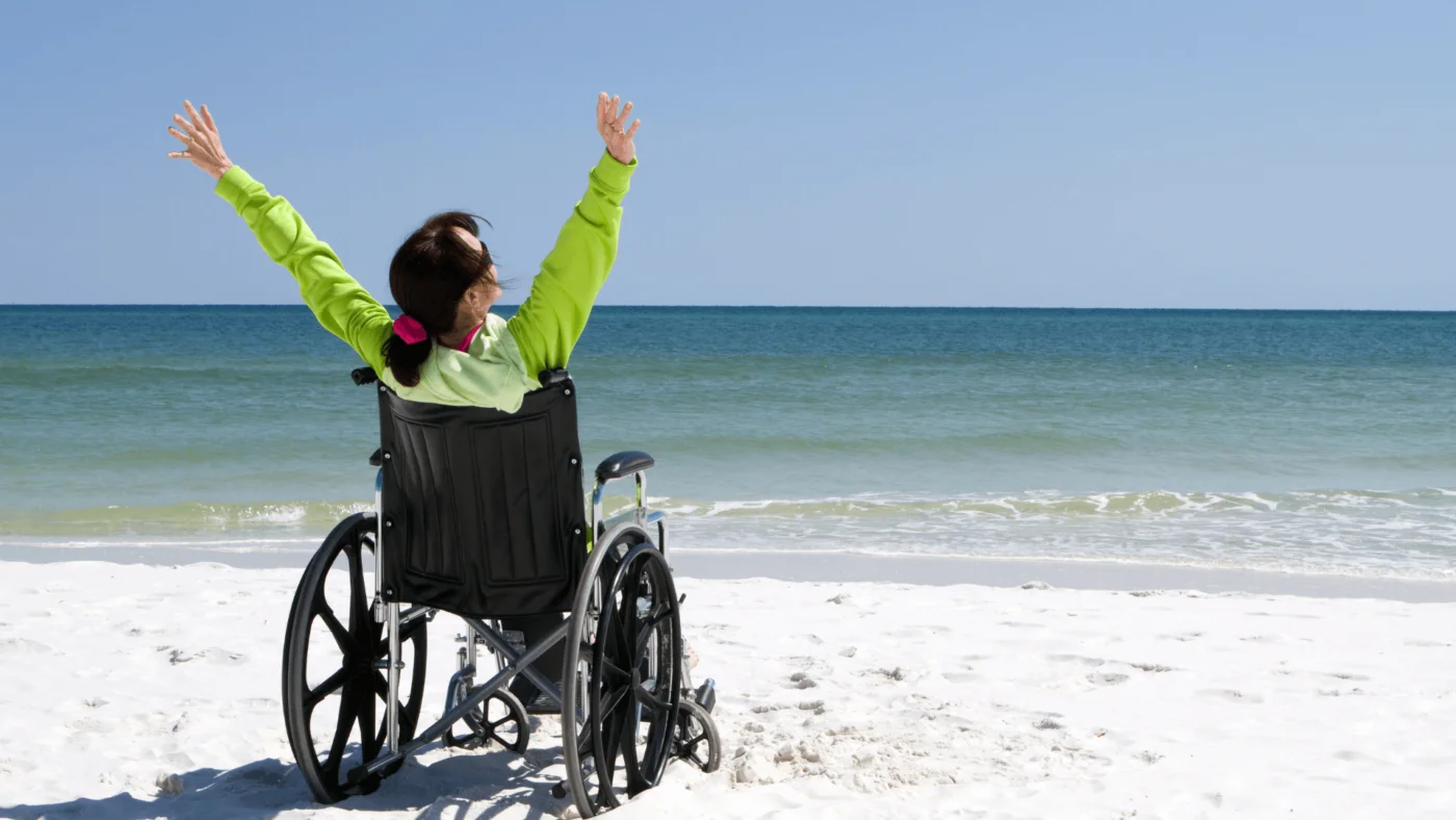 person at beach in wheelchair