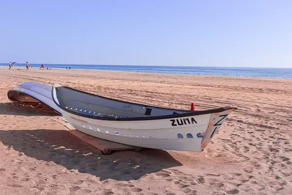 Boat-sitting-at-Zuma-Beach-in-California
