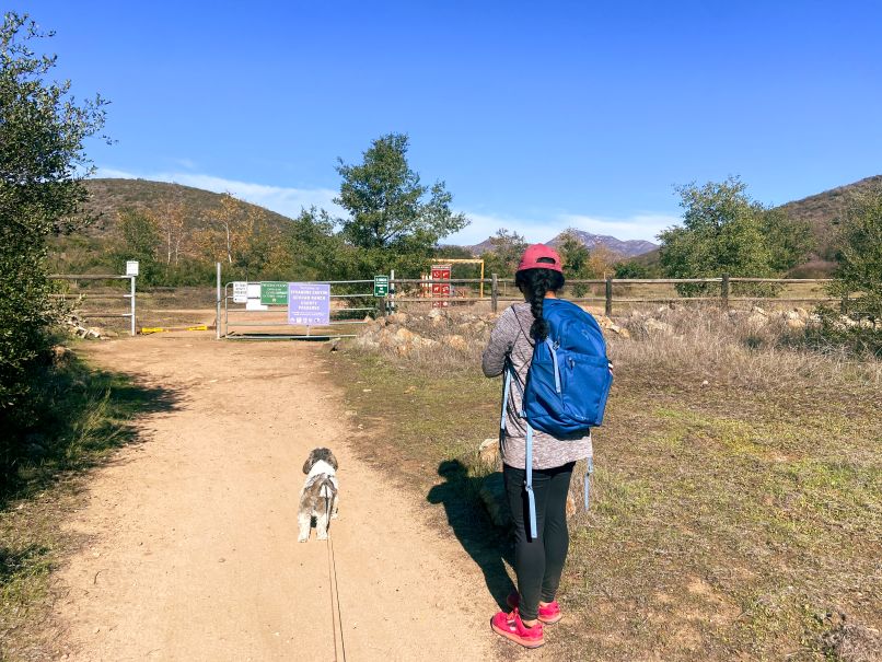 Jeanette and Tutu walking in Sycamore Dog Hike Trail